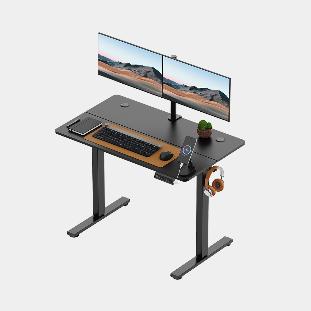 VonHaus black electric standing desk, 100 × 60 cm; computer equipment shown is not included